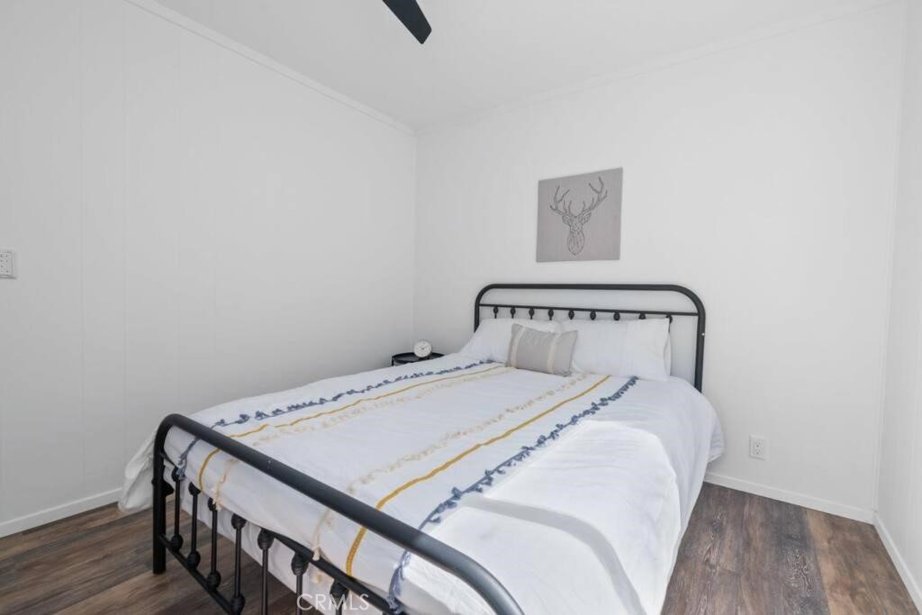 560 Edgemoor Road, Unit 1 Big Bear Lake, CA 92315 - Photo 5 of 10 a bedroom with a bed and a table