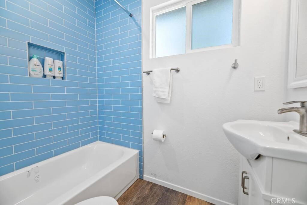 560 Edgemoor Road, Unit 1 Big Bear Lake, CA 92315 - Photo 6 of 10 a bathroom with a sink and bathtub