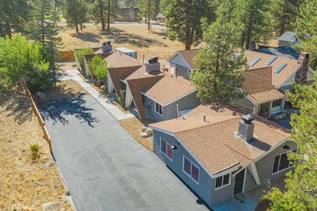 560 Edgemoor Road, Unit 1 Big Bear Lake, CA 92315 - Photo 10 of 10 an aerial view of a house with swimming pool and large trees