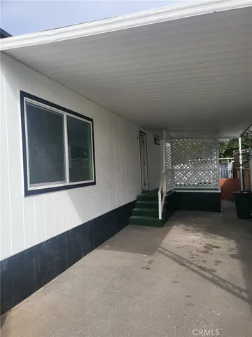 a view of an empty room with a bedroom