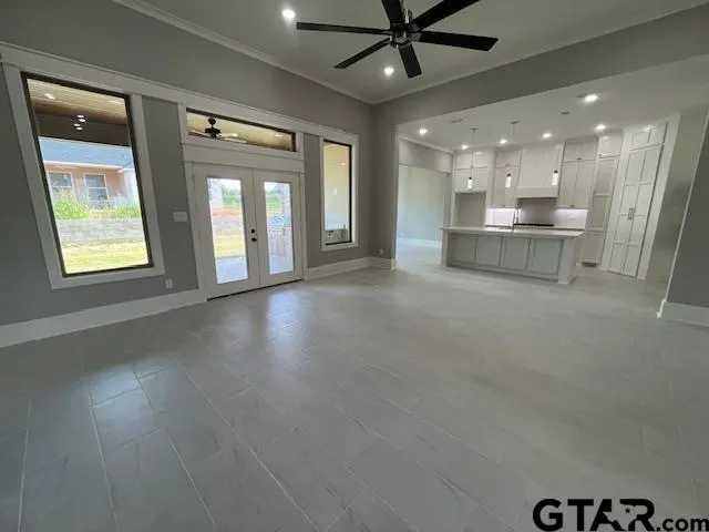 a view of a kitchen with a sink and a window