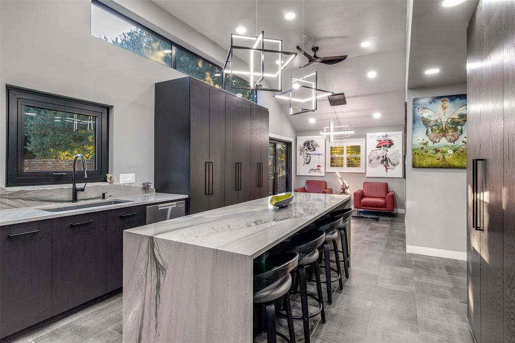 6566 Ridgeview Circle Dallas, TX 75240 - Photo 15 of 39 a kitchen with a sink a counter space appliances and cabinets