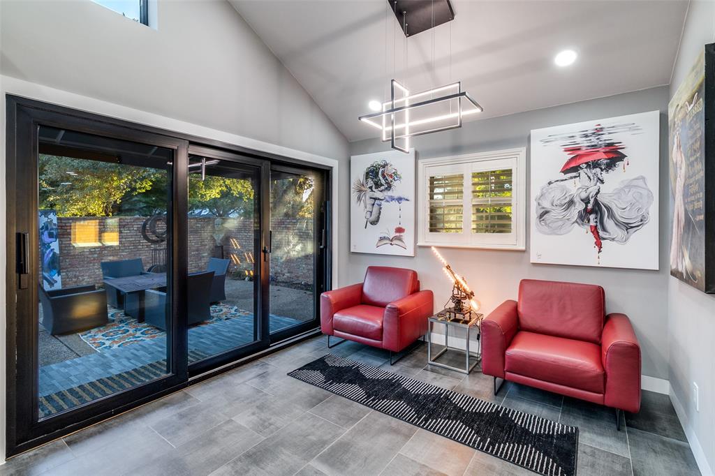 6566 Ridgeview Circle Dallas, TX 75240 - Photo 16 of 39 a living room with furniture a floor to ceiling window and outdoor view
