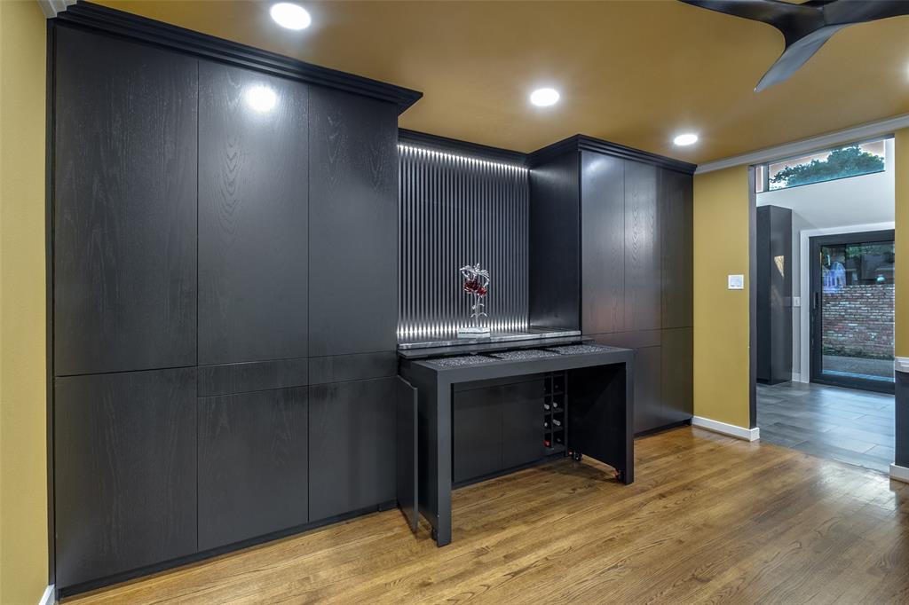 6566 Ridgeview Circle Dallas, TX 75240 - Photo 18 of 39 a kitchen with kitchen island a sink stainless steel appliances and cabinets