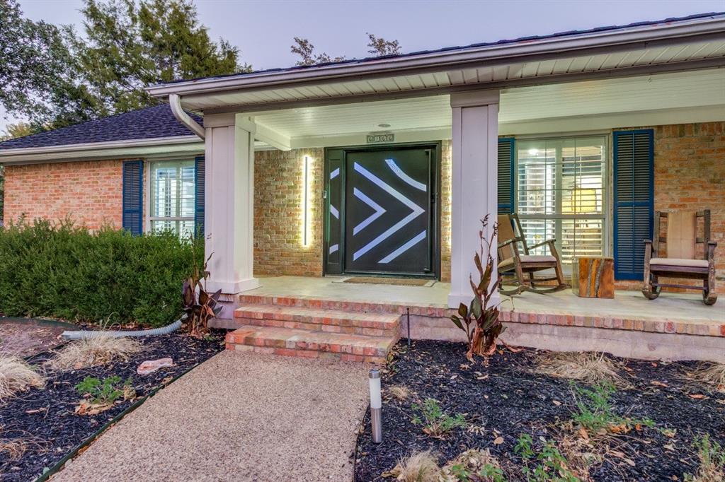 6566 Ridgeview Circle Dallas, TX 75240 - Photo 2 of 39 a front view of a house
