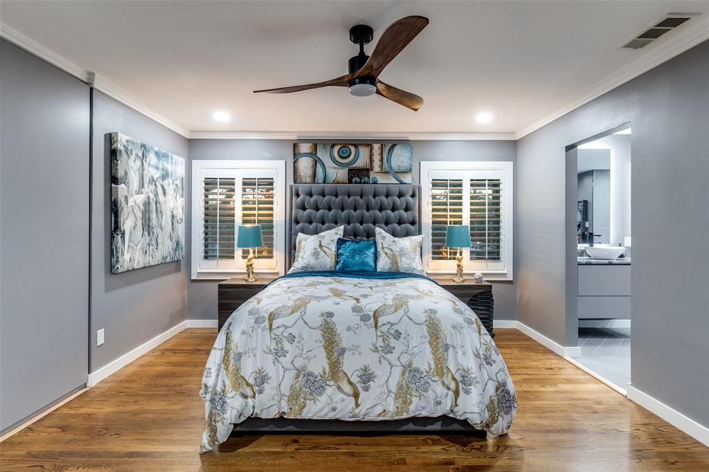 6566 Ridgeview Circle Dallas, TX 75240 - Photo 21 of 39 a bed sitting in a spacious bedroom next to a window