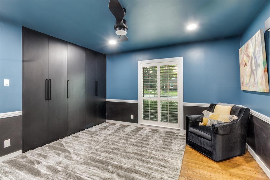 6566 Ridgeview Circle Dallas, TX 75240 - Photo 26 of 39 a bedroom with a bed and glass window