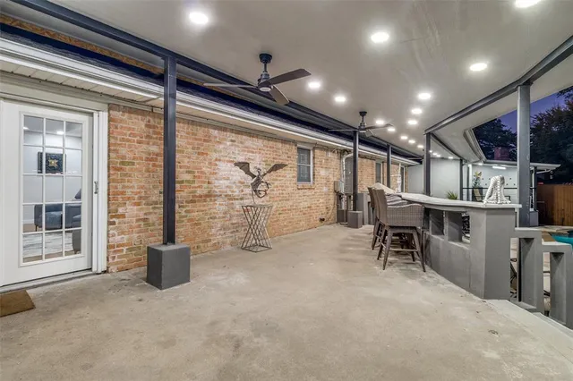 a view of a big dining room with furniture