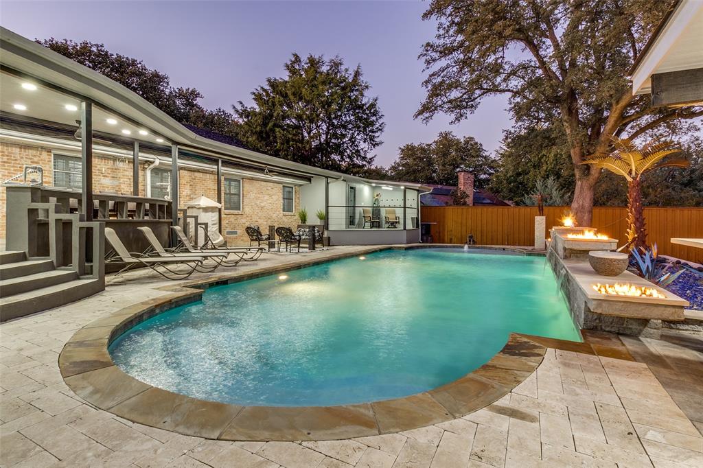 6566 Ridgeview Circle Dallas, TX 75240 - Photo 34 of 39 a view of a swimming pool with a patio
