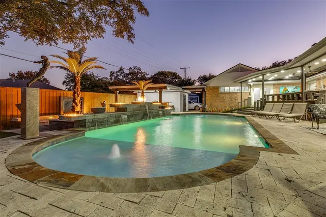 a view of swimming pool with outdoor seating