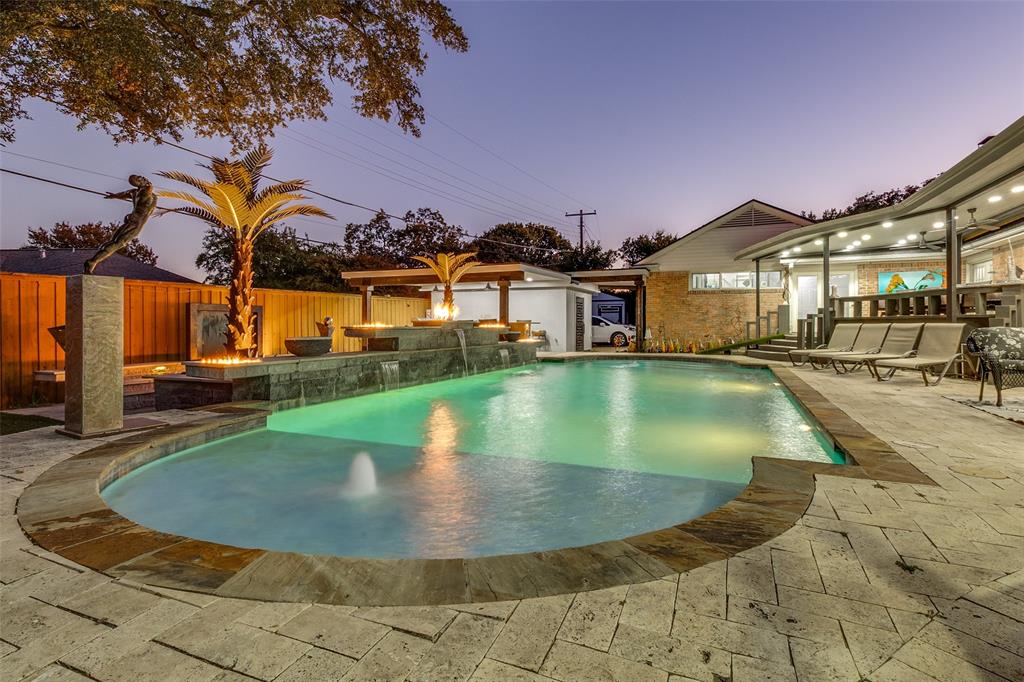 6566 Ridgeview Circle Dallas, TX 75240 - Photo 35 of 39 a view of a house with swimming pool and sitting area