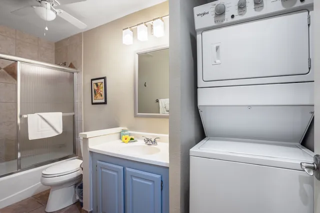 a bathroom with a toilet sink and shower