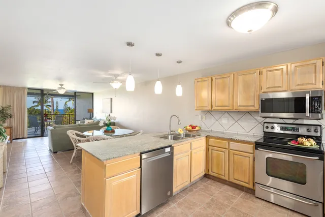 a kitchen with a sink stove and microwave
