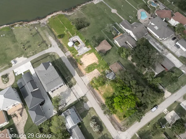 an aerial view of a residential houses with outdoor space