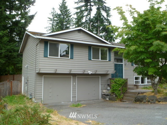 21905 7th Place West Bothell, WA 98021 - Photo 1 of 1 a front view of a house with a garden