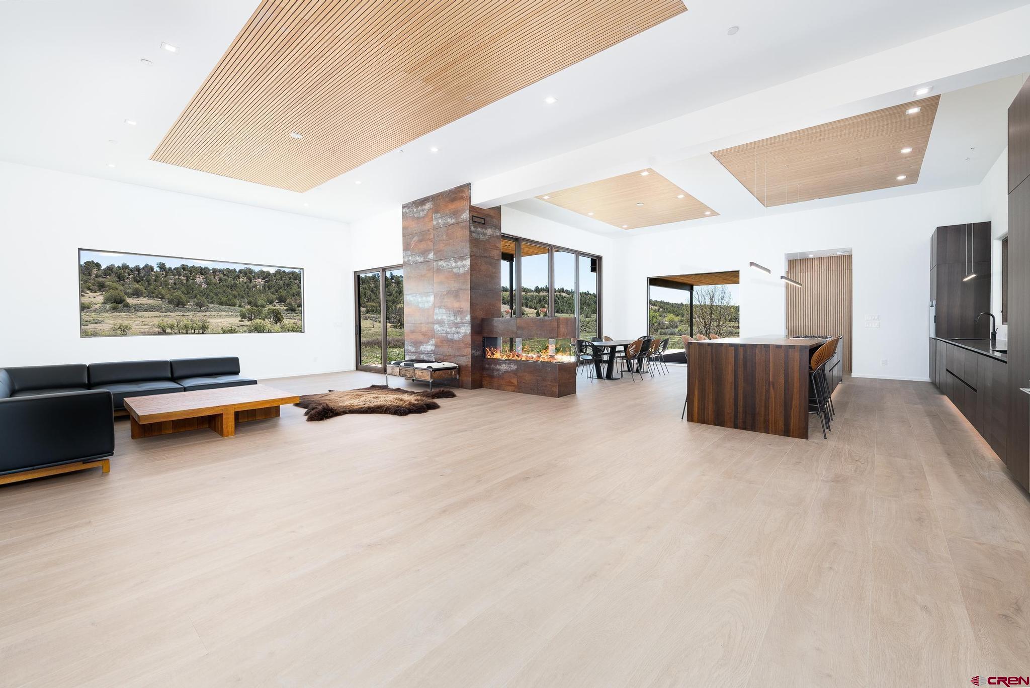 201 Cowboy Trail Durango, CO 81303 - Photo 17 of 45 a living room with furniture and a flat screen tv