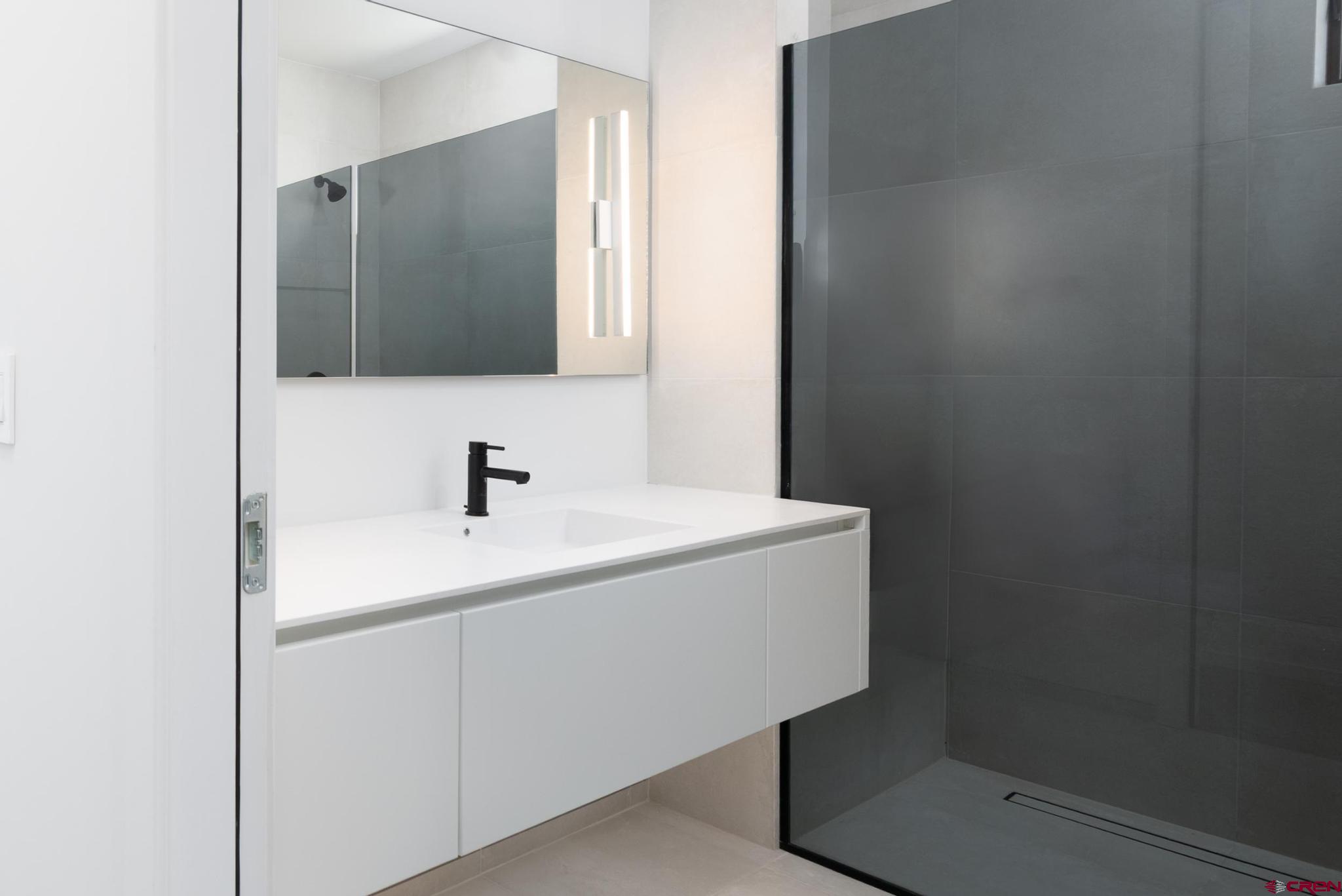 201 Cowboy Trail Durango, CO 81303 - Photo 21 of 45 a bathroom with a sink and a mirror