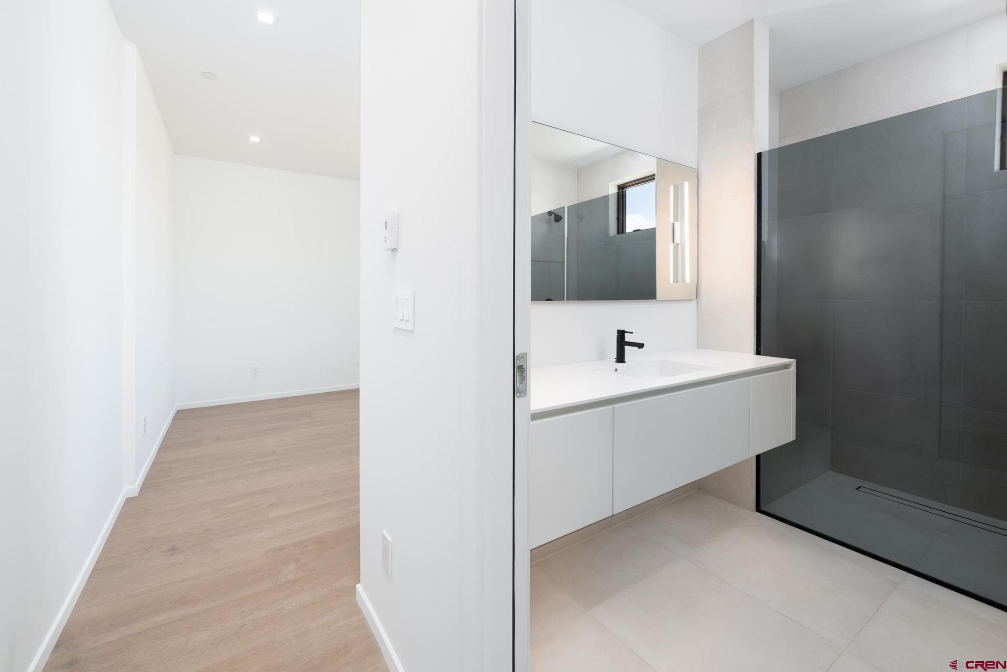 201 Cowboy Trail Durango, CO 81303 - Photo 23 of 45 a bathroom with a sink and a mirror