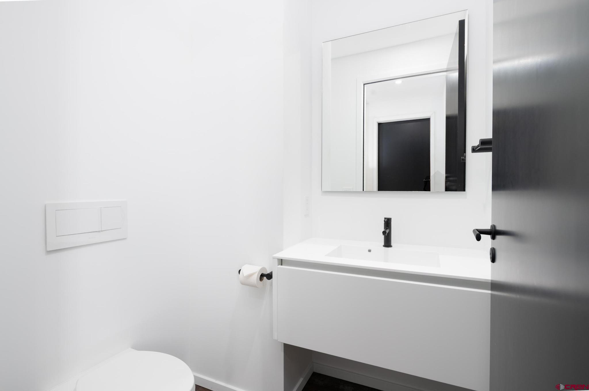 201 Cowboy Trail Durango, CO 81303 - Photo 28 of 45 a bathroom with a sink and a mirror