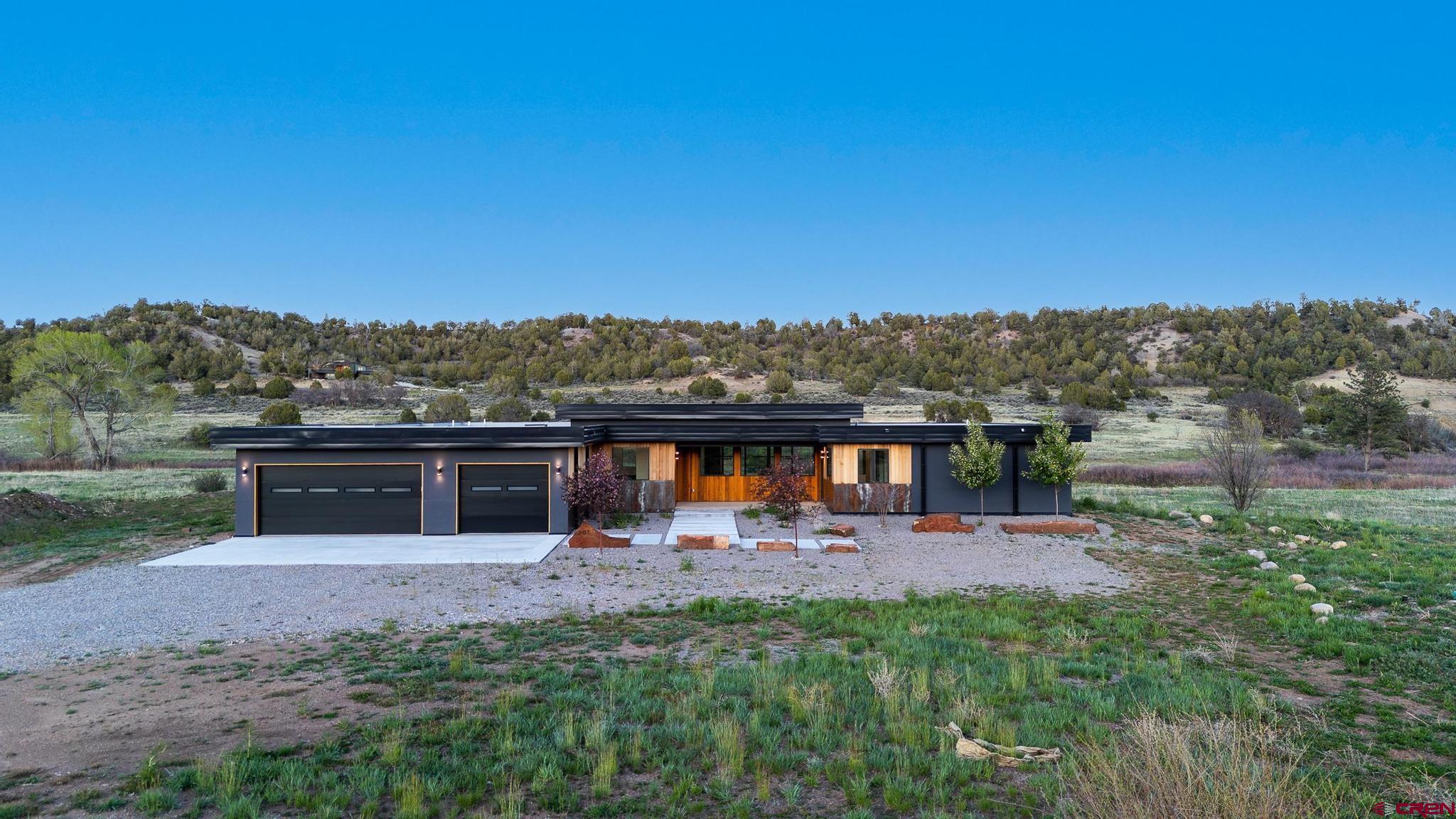201 Cowboy Trail Durango, CO 81303 - Photo 42 of 45 a view of a house with a yard and lake view