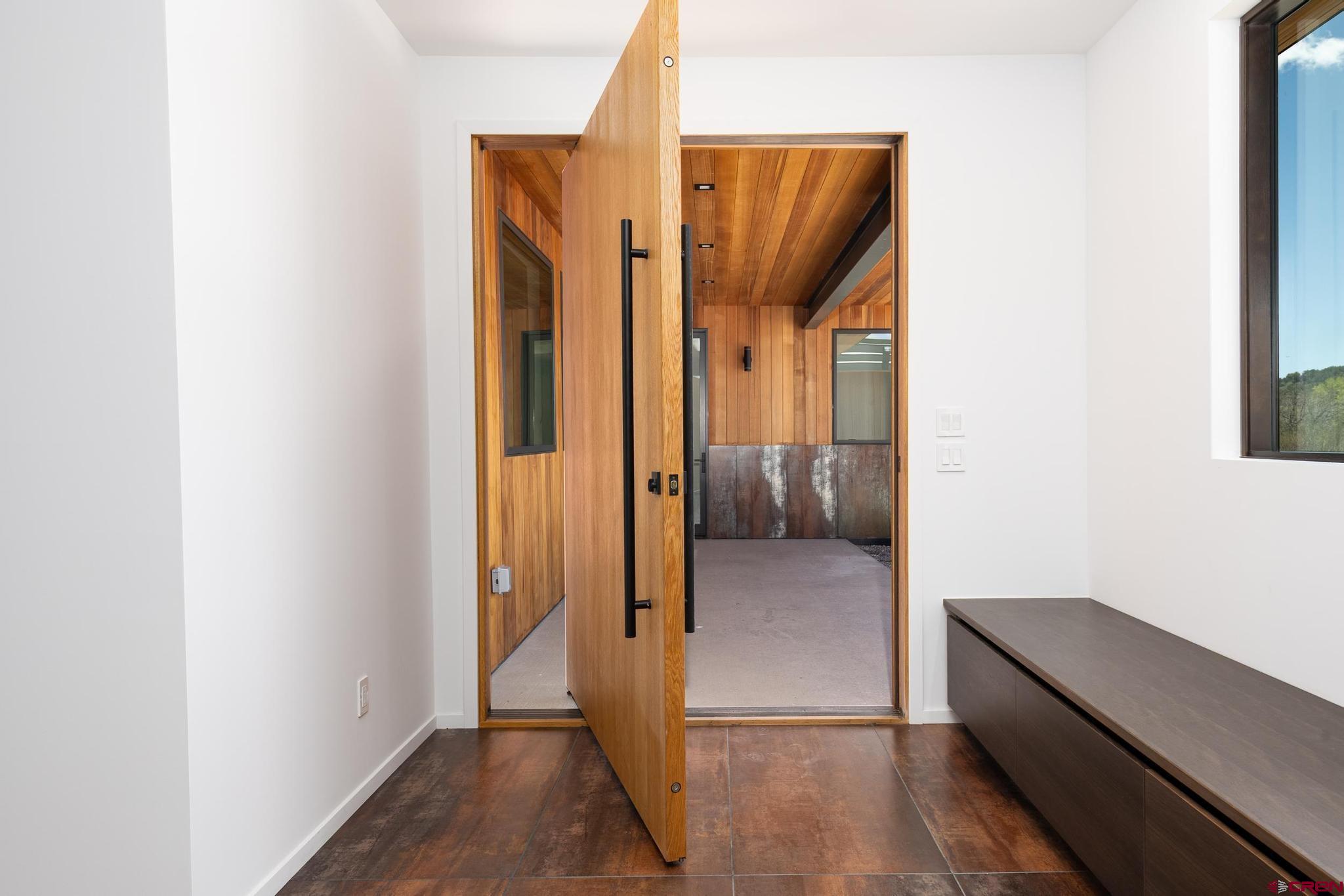201 Cowboy Trail Durango, CO 81303 - Photo 7 of 45 a view of hallway with walk in closet and wooden floor