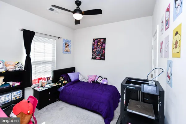 a bed room with a bed and a table