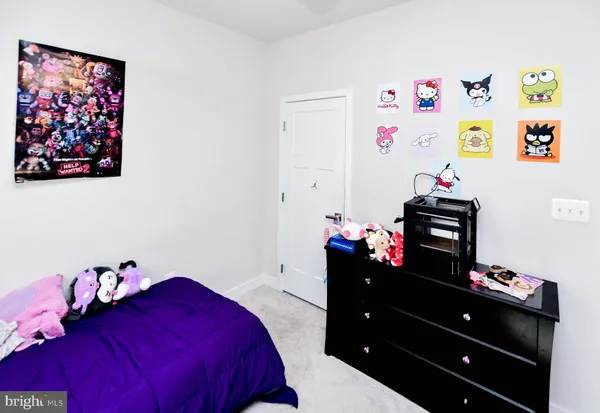 a view of a bedroom from a hallway