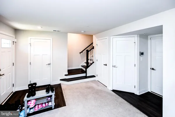 a living room with furniture and a rug