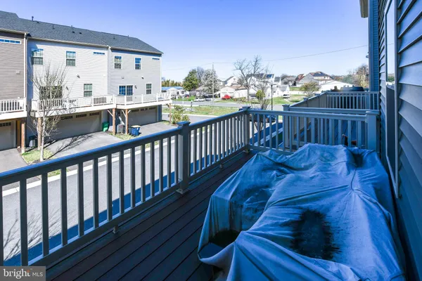 a view of a house with a garden and deck