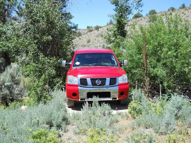 an aerial view of a house with a yard and balcony
