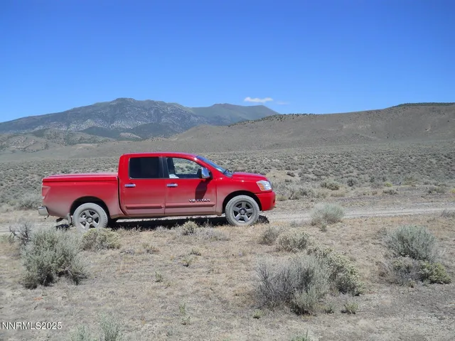 a view of a cars is parked in a field