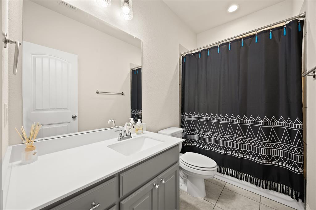 2618 Byrd Ranch Road Midlothian, TX 76065 - Photo 28 of 38 a bathroom with a sink a toilet and shower