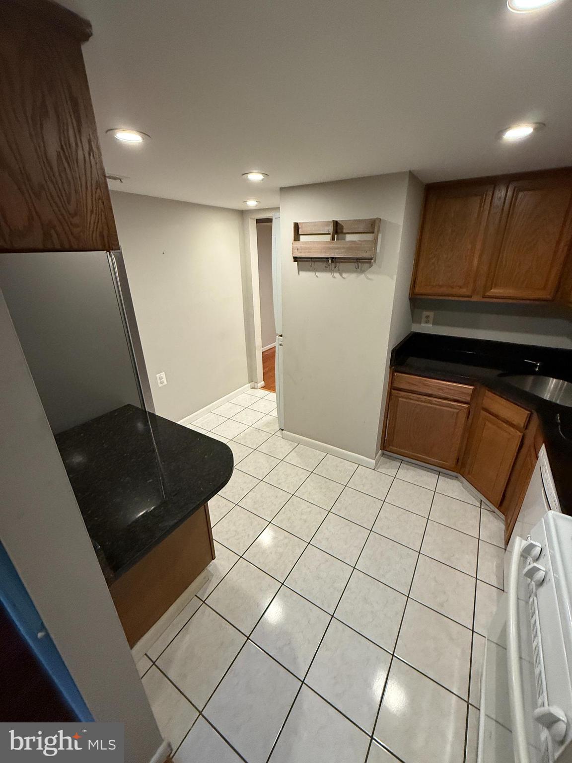 1404 Northgate Square, Unit 4/12B Reston, VA 20190 - Photo 3 of 10 a view of an empty room and kitchen