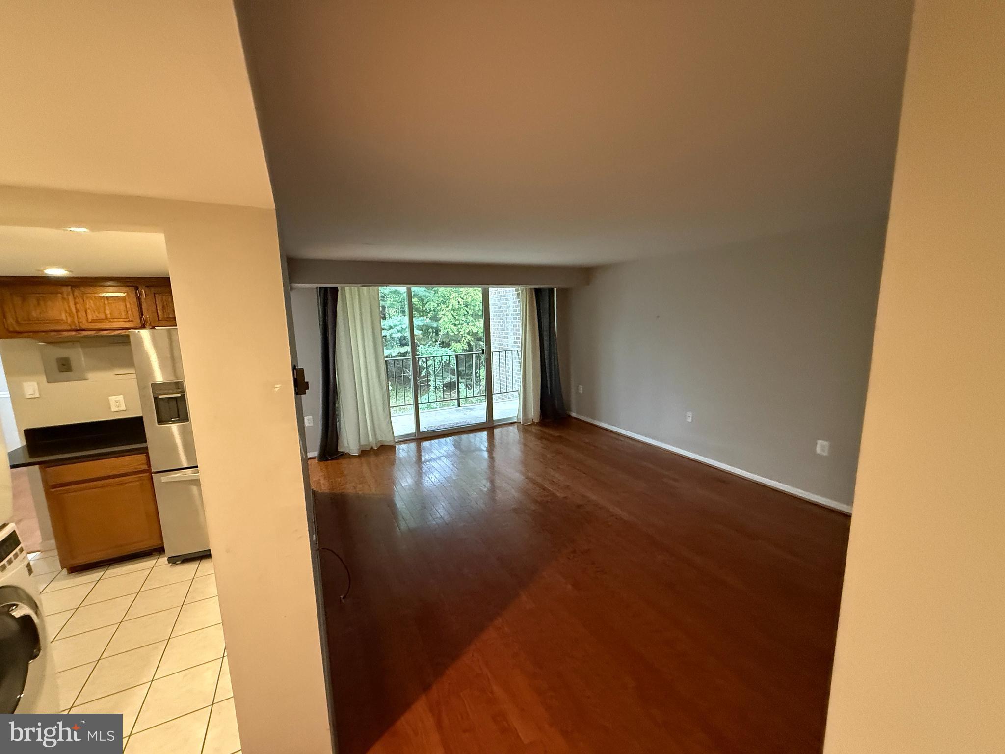 1404 Northgate Square, Unit 4/12B Reston, VA 20190 - Photo 4 of 10 a view of a kitchen with a sink and dishwasher in white cabinet