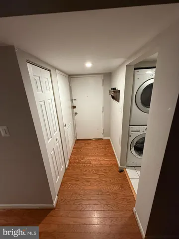 a view of hallway with washer and dryer