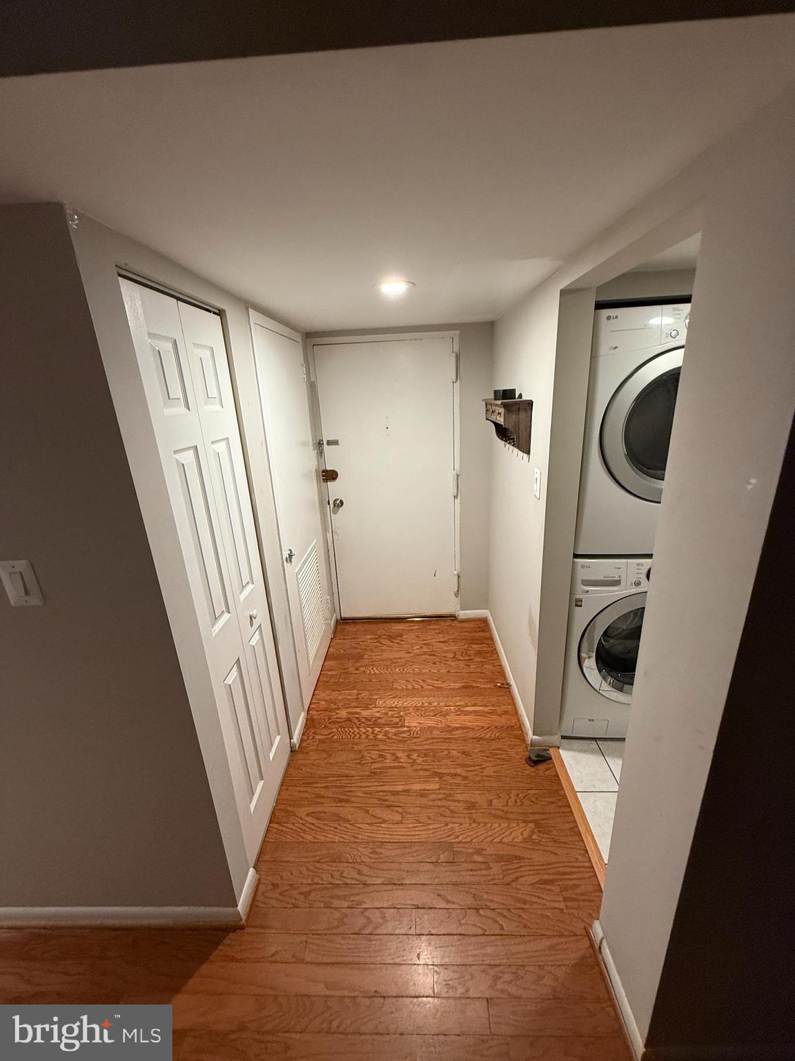1404 Northgate Square, Unit 4/12B Reston, VA 20190 - Photo 5 of 10 a view of hallway with washer and dryer