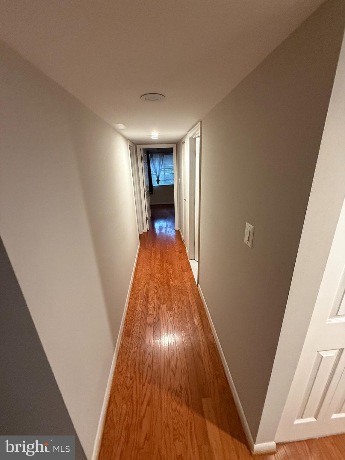 1404 Northgate Square, Unit 4/12B Reston, VA 20190 - Photo 7 of 10 a view of a hallway with wooden floor