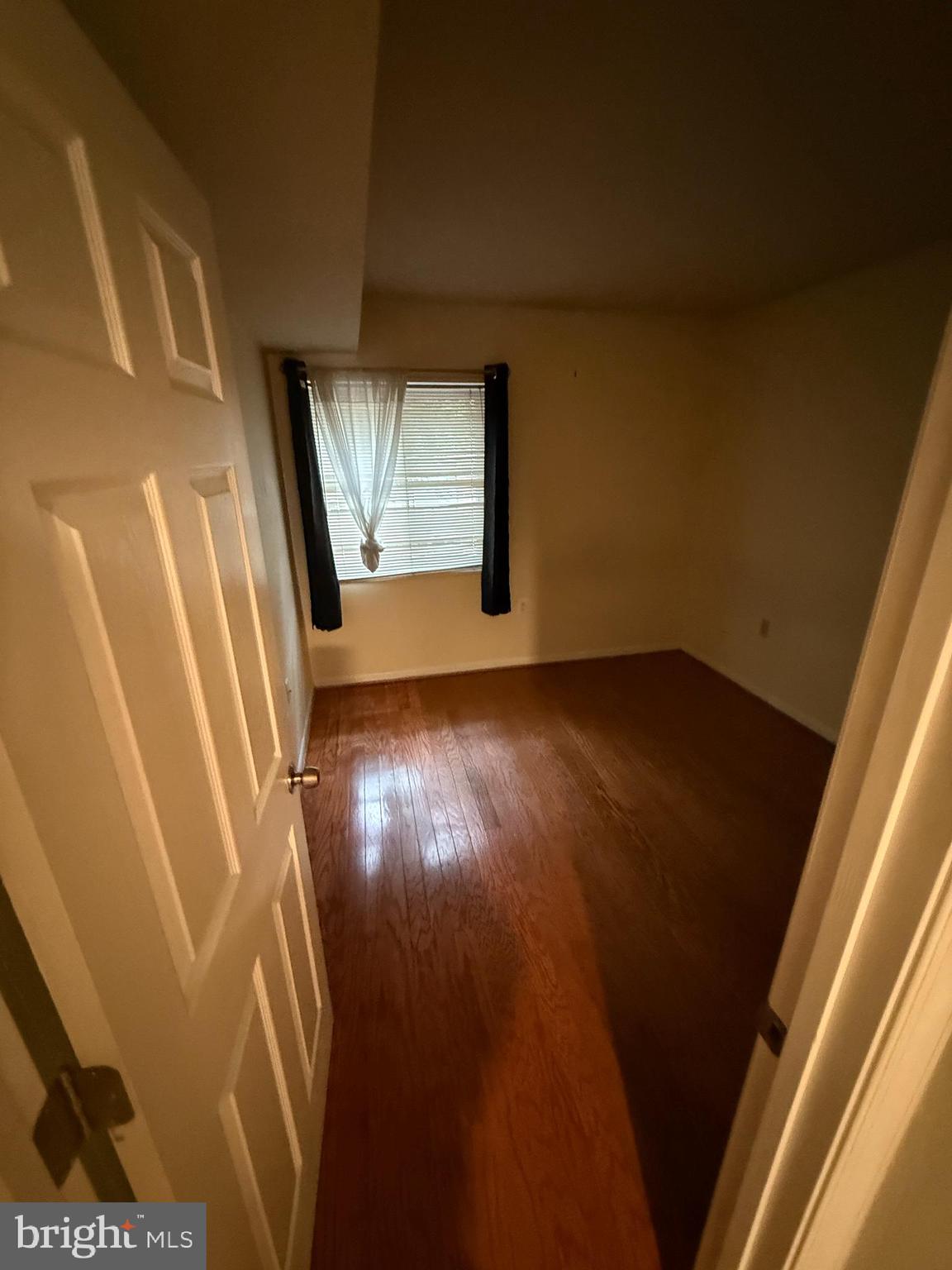 1404 Northgate Square, Unit 4/12B Reston, VA 20190 - Photo 8 of 10 a view of an empty room and wooden floor