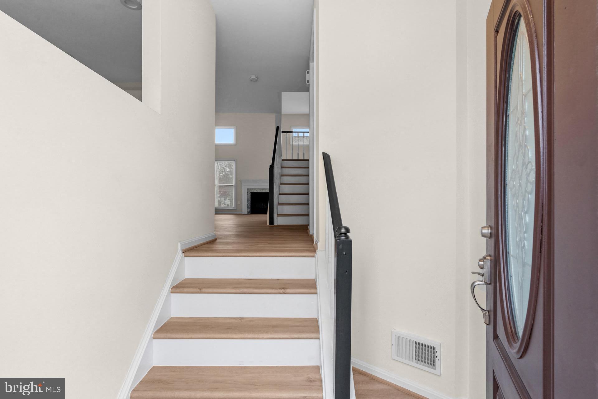 13920 Baton Rouge Court Centreville, VA 20121 - Photo 2 of 45 a view of entryway and hall with wooden floor