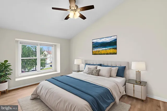 a bedroom with a large bed and a window