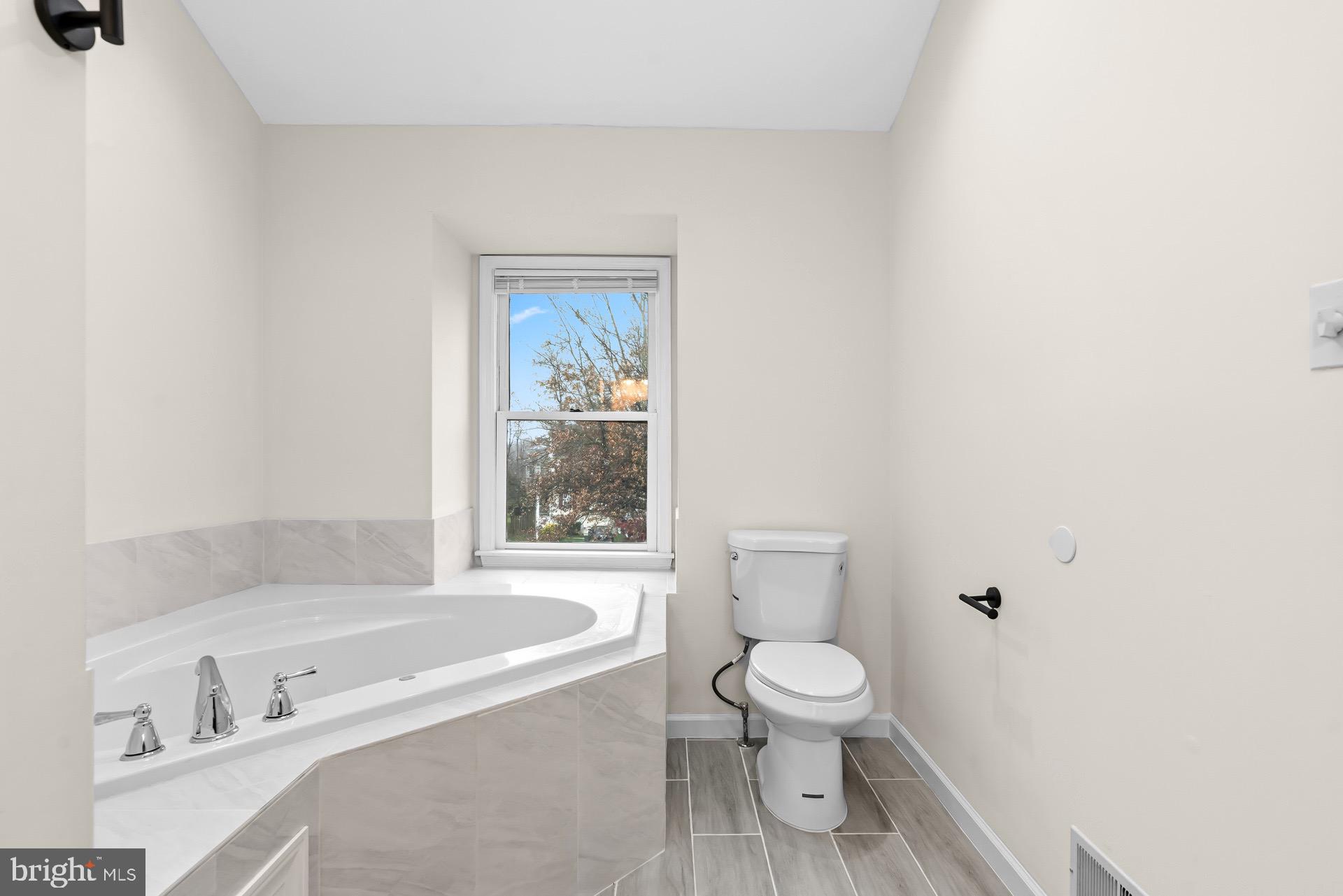 13920 Baton Rouge Court Centreville, VA 20121 - Photo 25 of 45 a bathroom with a toilet a sink and a bathtub