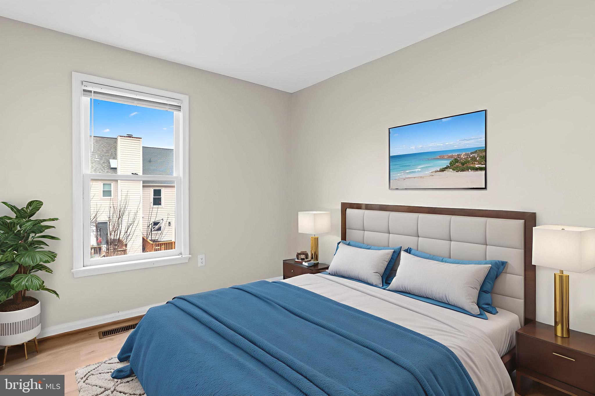 13920 Baton Rouge Court Centreville, VA 20121 - Photo 27 of 45 a bedroom with a bed and a painting on the wall