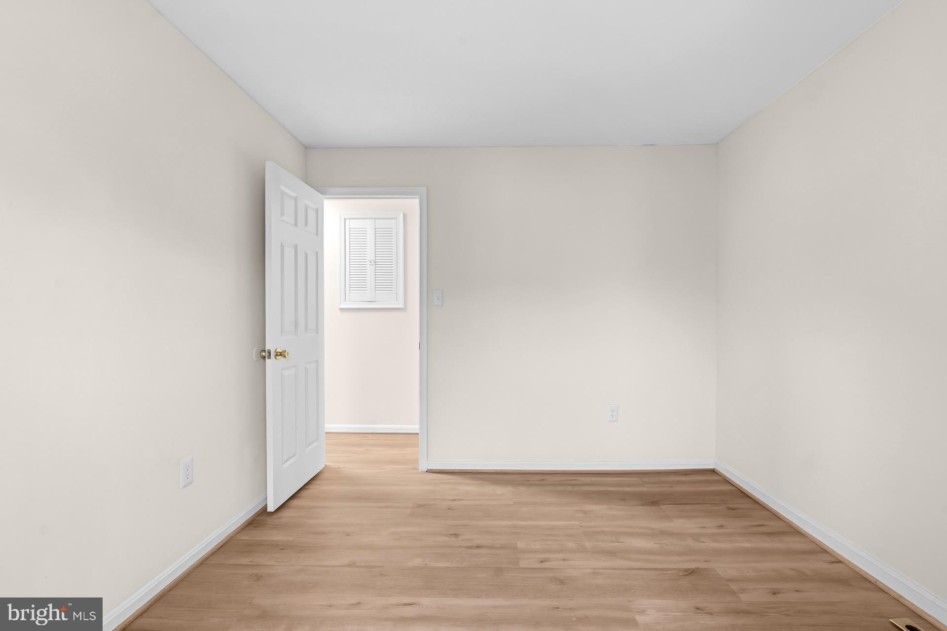 13920 Baton Rouge Court Centreville, VA 20121 - Photo 29 of 45 a view of an empty room and wooden floor