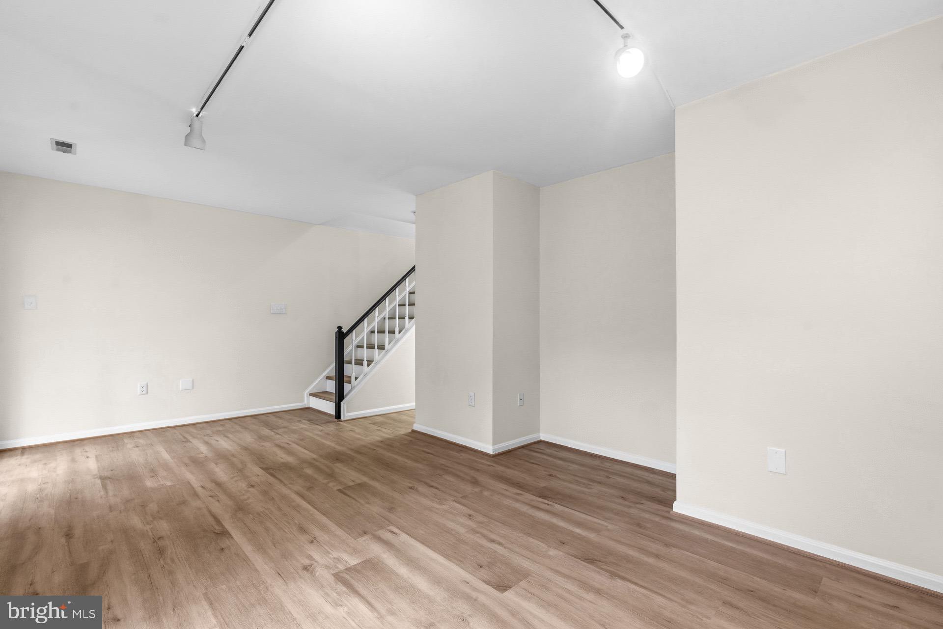 13920 Baton Rouge Court Centreville, VA 20121 - Photo 35 of 45 a view of empty room with wooden floor
