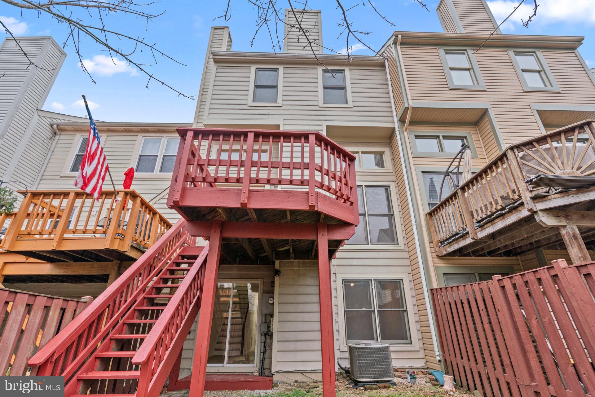 13920 Baton Rouge Court Centreville, VA 20121 - Photo 42 of 45 a front view of a house with many windows