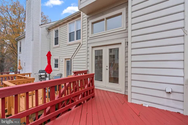 a view of a house with wooden fence