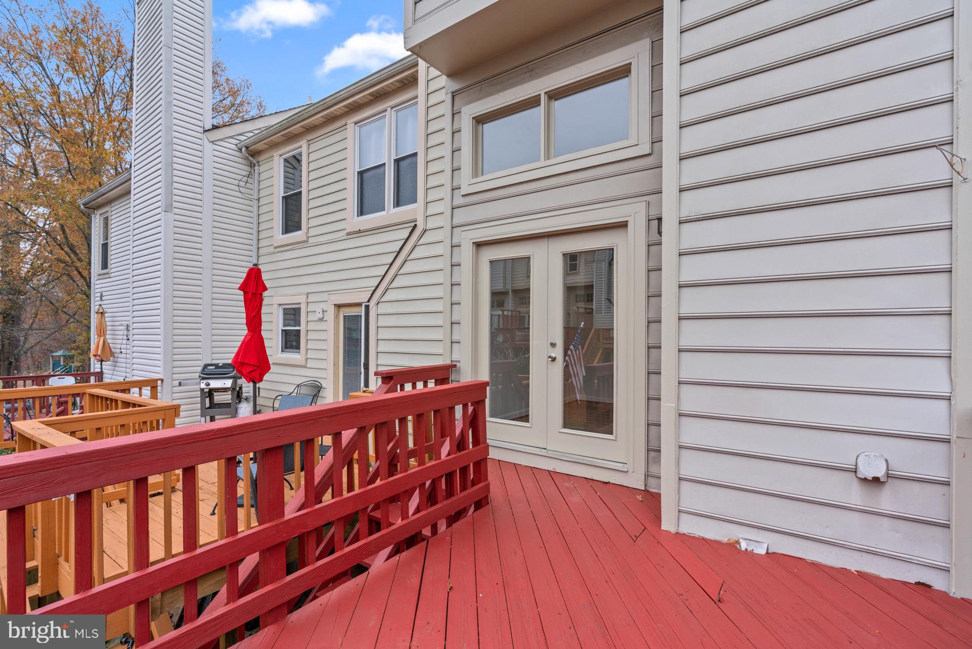 13920 Baton Rouge Court Centreville, VA 20121 - Photo 44 of 45 a view of a house with wooden deck