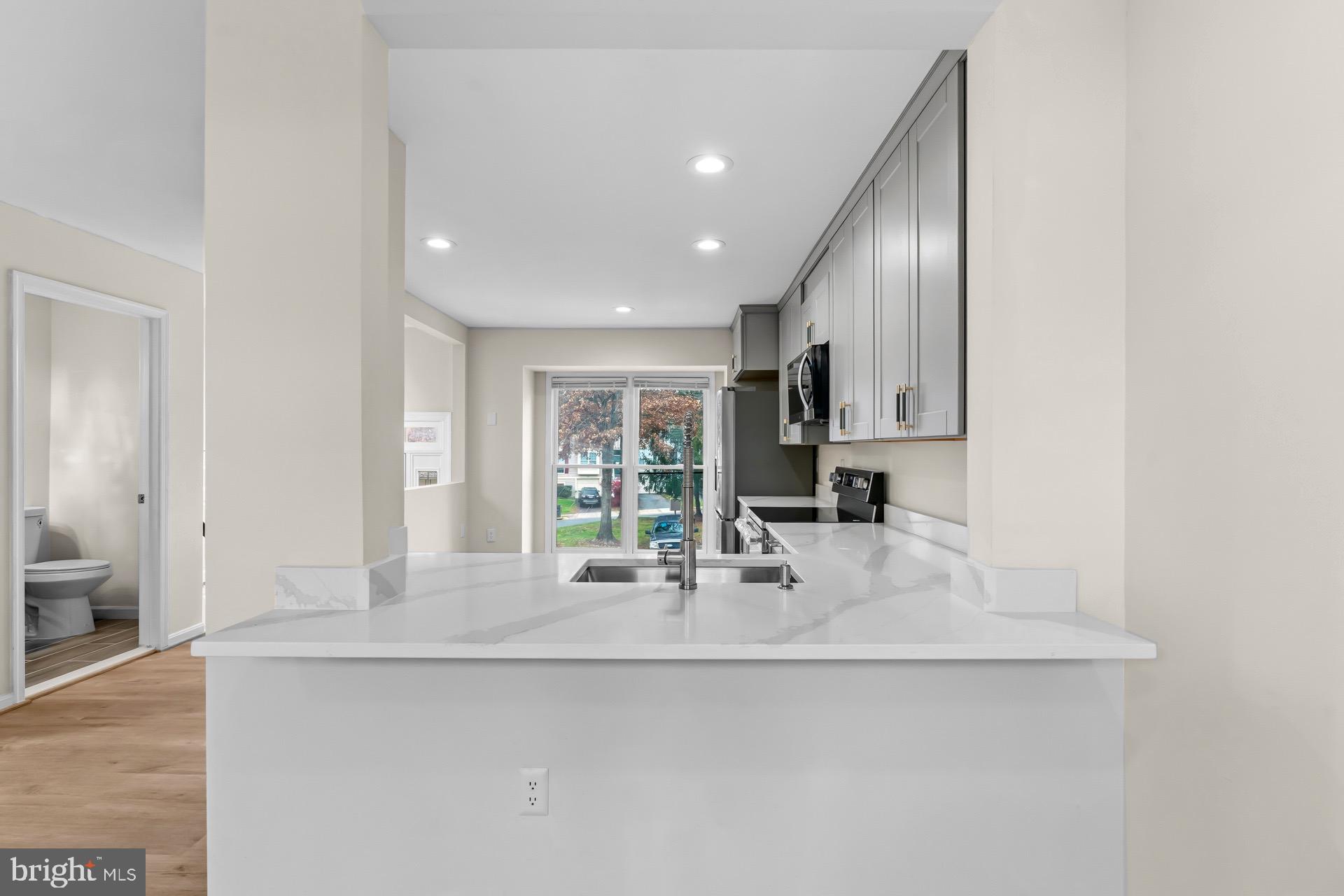 13920 Baton Rouge Court Centreville, VA 20121 - Photo 6 of 45 a kitchen with stainless steel appliances a sink and a refrigerator
