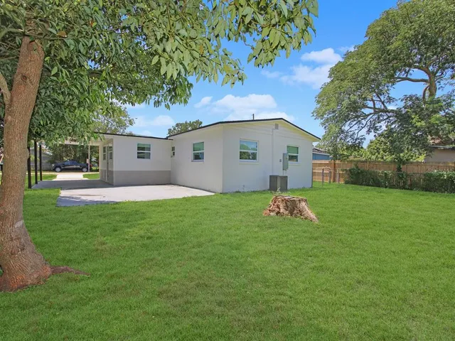 a backyard of a house with lots of green space