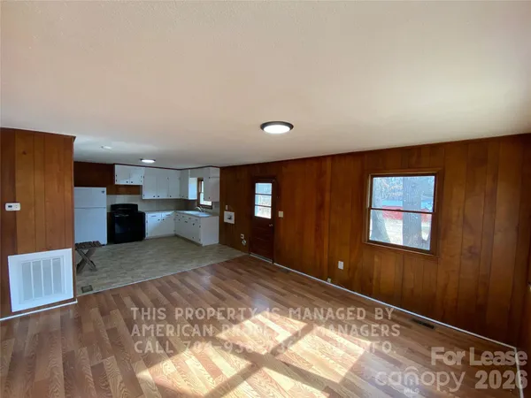 a large room with kitchen view